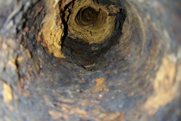Closeup shot of the inside of an old sewer pipe